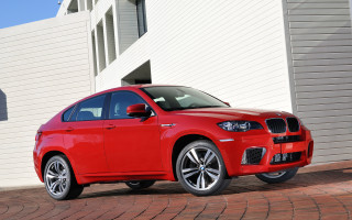 Red car brick road white - a white building free wallpaper