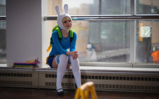 Bunny costume sitting window sill - her back and a backpack free wallpaper