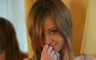 Woman brushing teeth blurry mirror - a towel free wallpaper