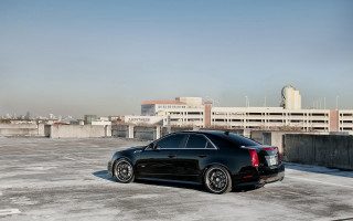 Black car parking lot city - a black car free wallpaper