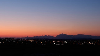 City skyline mountains sunset clouds - correggio free wallpaper