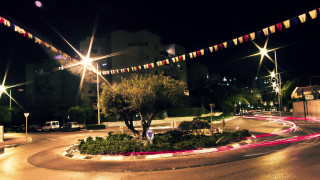 Night cityscape light trails tree - a long exposure free wallpaper