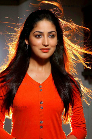 Woman orange shirt long hair - free light wallpaper for mobile