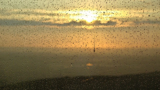 Sunset rainy window cellphone tower - anamorphic free wallpaper