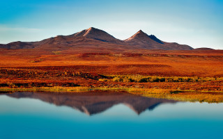 Mountain lake grassy plain sky - a lake in the foreground free wallpaper