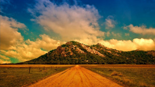 Dirt road mountain background clouds - a dirt road free wallpaper