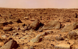 Barren rocks dirt plane space - overhead in the distance free wallpaper