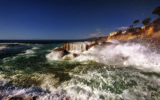 Wave rocks beach sunny sky - a blue sky above free wallpaper