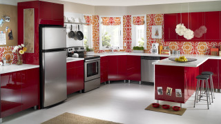 Kitchen red cabinets silver fridge - a bowl of fruit free wallpaper
