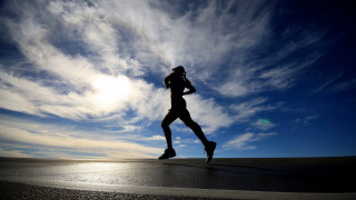 Man running beach sky clouds 2 - the background and a sun free wallpaper