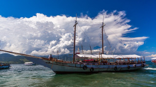 Boat water mountains cloudy sky - filter free wallpaper