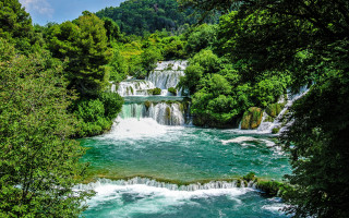 River waterfall trees bushes blue - a waterfall in the middle of it free wallpaper