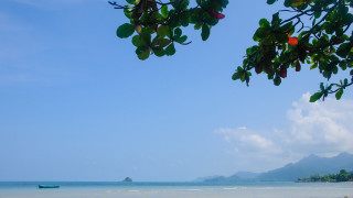 Boat beach mountains sky clouds - free bikini wallpaper