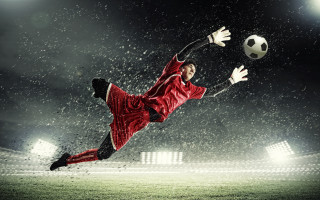 Soccer player red uniform kicking 2 - a red uniform free wallpaper for desktop