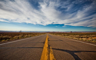 Long road sky clouds beach - a yellow line free wallpaper
