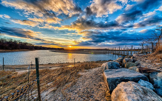 Sunset water shore rocks fence - the shore free wallpaper