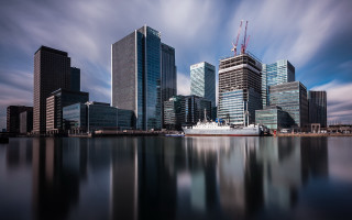 City boat tall buildings cloudy - a large boat free wallpaper