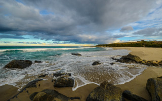 Beach rocks water cloudy sky 18 - a few wave free wallpaper
