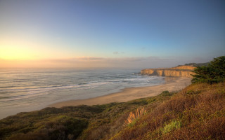 Beach cliff sunset landscape trees - a cliff and a body of water free wallpaper