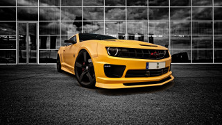 Yellow sports car building cloudy 3 - a yellow sports car free wallpaper