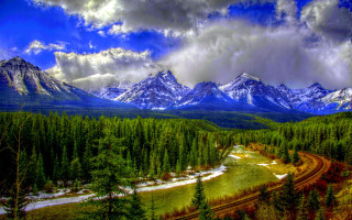 Mountain range river snow capped 9 - a scenic view of a mountain range free wallpaper