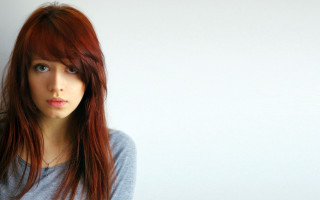Red haired woman blue eyes 22 - a white wall free wallpaper for desktop