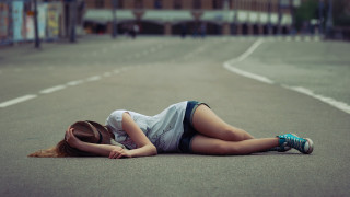 Woman laying street denim shorts - her head and a hat free wallpaper