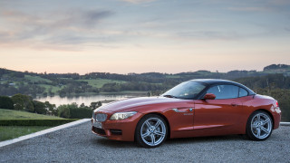 Red sports car lake hill - a red sports car free wallpaper