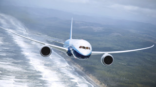 Large jetliner over hills and - turnaround free wallpaper for desktop