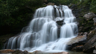 Waterfall rocks forest light rays - a bunch of water free wallpaper