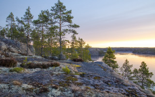 Rocky cliff lake sunset trees - a lake in the background free wallpaper