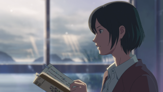 Woman holding book looking out - a book in her hand free wallpaper