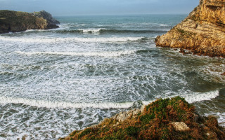 Wave riders beach cliff ocean - a cliff face free wallpaper for desktop