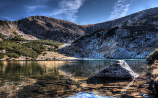 Lake mountains rock shore clouds - a rock in the middle of it free wallpaper