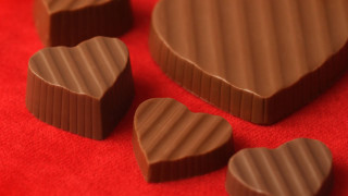 Heart shape chocolates red background - chocolate free wallpaper