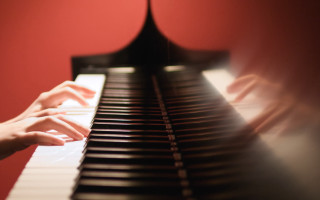 Hands playing piano red black - a persons hand free wallpaper