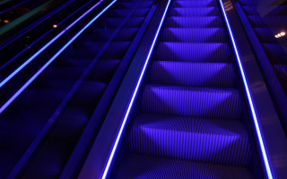 Blue escalator lights person cyberpunk - side and a person free wallpaper
