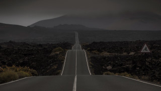Desolate road mountains sky forest - a long road free wallpaper