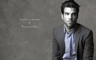 Man in suit tie sitting - his hands in his pockets free wallpaper for desktop