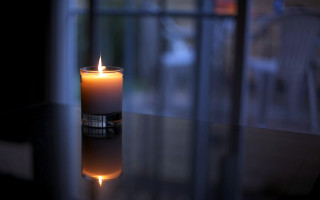 Lit candle table window reflection - candle free wallpaper