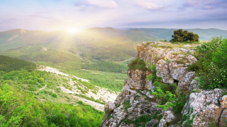 Sunrise valley mountains flower field - a view of a valley and mountains free wallpaper