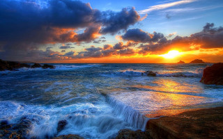 Sunset ocean waves rocks foreground - a sunset over the ocean free wallpaper