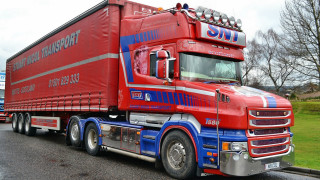 Red truck blue trailer parking - a red semi truck free wallpaper