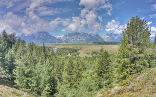 Mountain range forest river sunset - a scenic view of a mountain range free wallpaper
