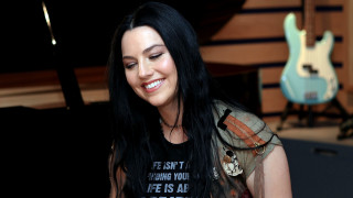 Woman smiling black hair guitar - free dark wallpaper