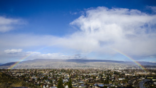 Rainbow city mountains tiltshift lensflare - over a city free wallpaper for desktop