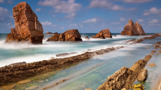 Rocky beach water people impressionist - a few rock free wallpaper