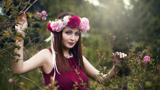 Woman flower hair field portrait - her hand behind her head free wallpaper