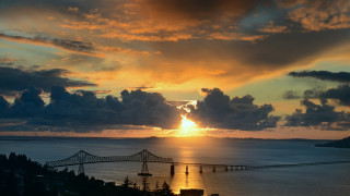 Sunset water bridge clouds dusk - a bridge in the distance free wallpaper