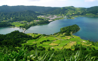 Lake hills trees town mountains - a view of a lake free wallpaper